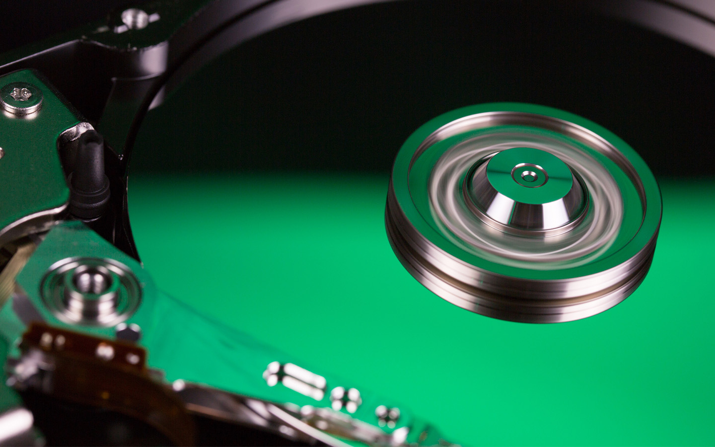 Internal view of an external hard drive features a green glow.