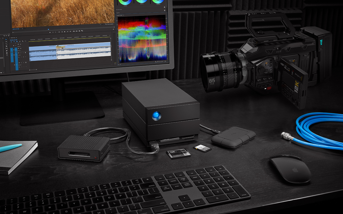 Edit studio features LaCie 1big Dock SSD, mini drive, desktop, SSD cards, keyboard, and video camera.