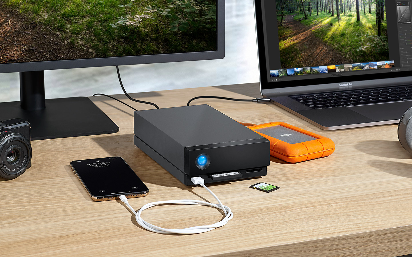 Laptop, desktop, and phone are connected to LaCie 1big Dock and Rugged Mini drive.