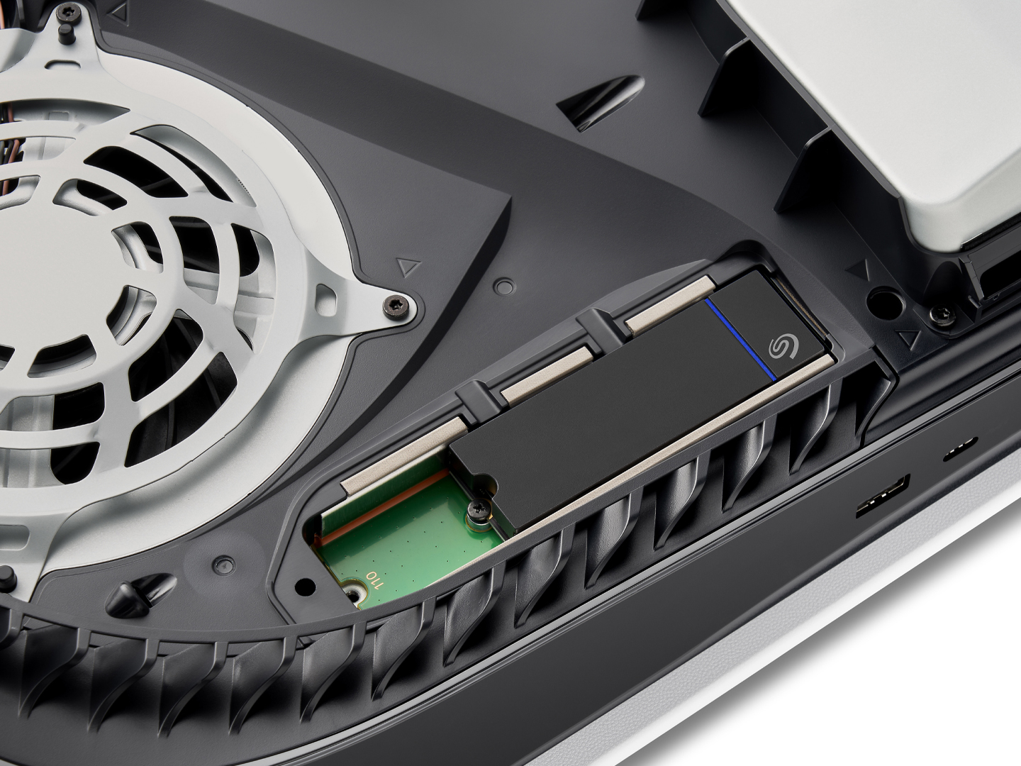 Seagate PS5 NVMe SSD is shown placed inside a PlayStation system.
