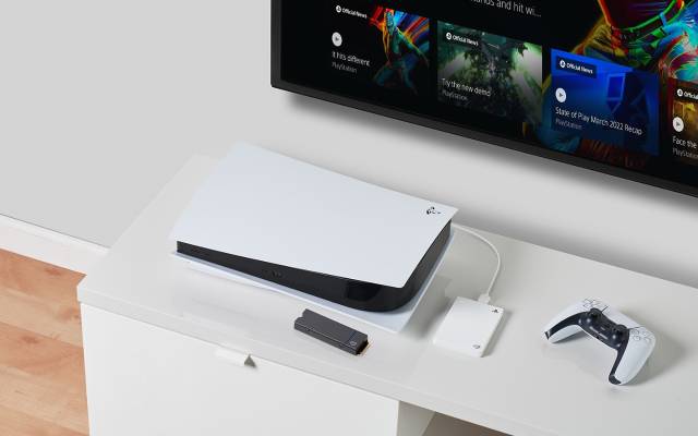White Seagate PlayStation portable hard drive connected to a white PS5 system is displayed with a controller and game on screen.