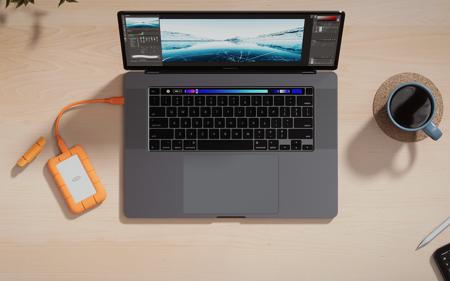 LaCie Rugged Mini SSD—with its protective cap nearby—is connected to a laptop