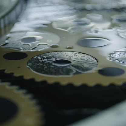 Extreme up-close shot of multiple gears interconnected.