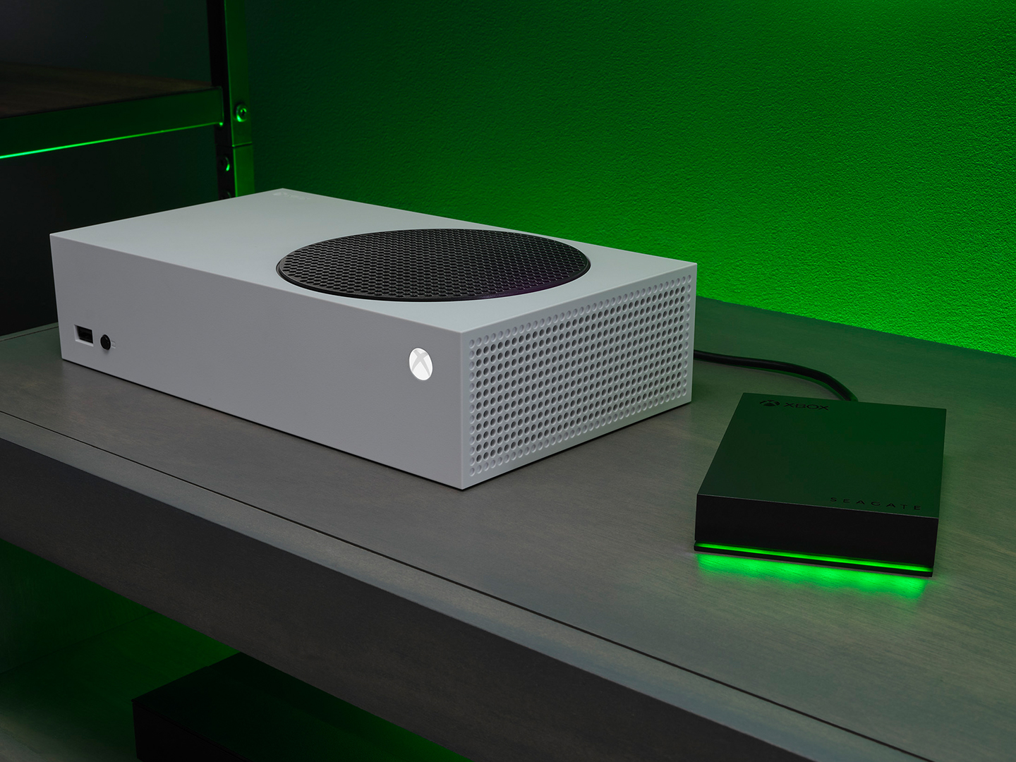 Black Seagate external hard drive plugged into a white Xbox® gaming system.