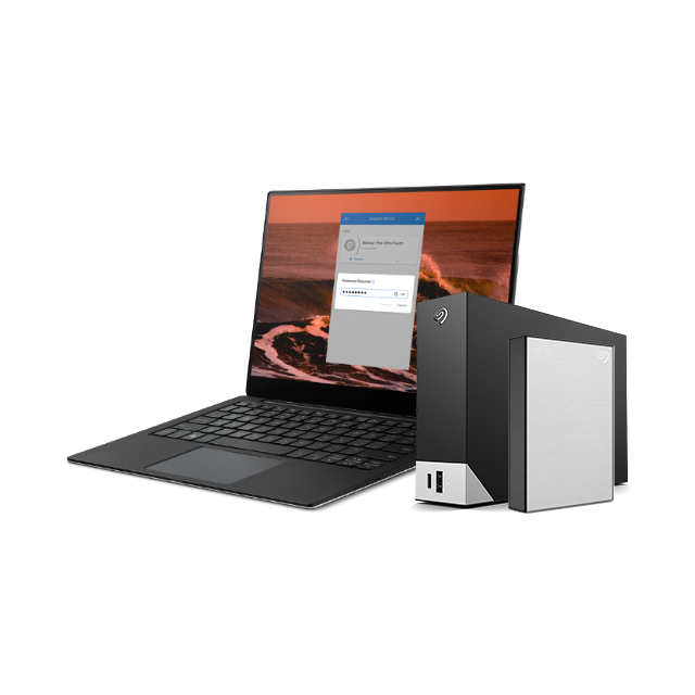 Laptop featuring a password field stands next to a Seagate One Touch Hub and external drive.