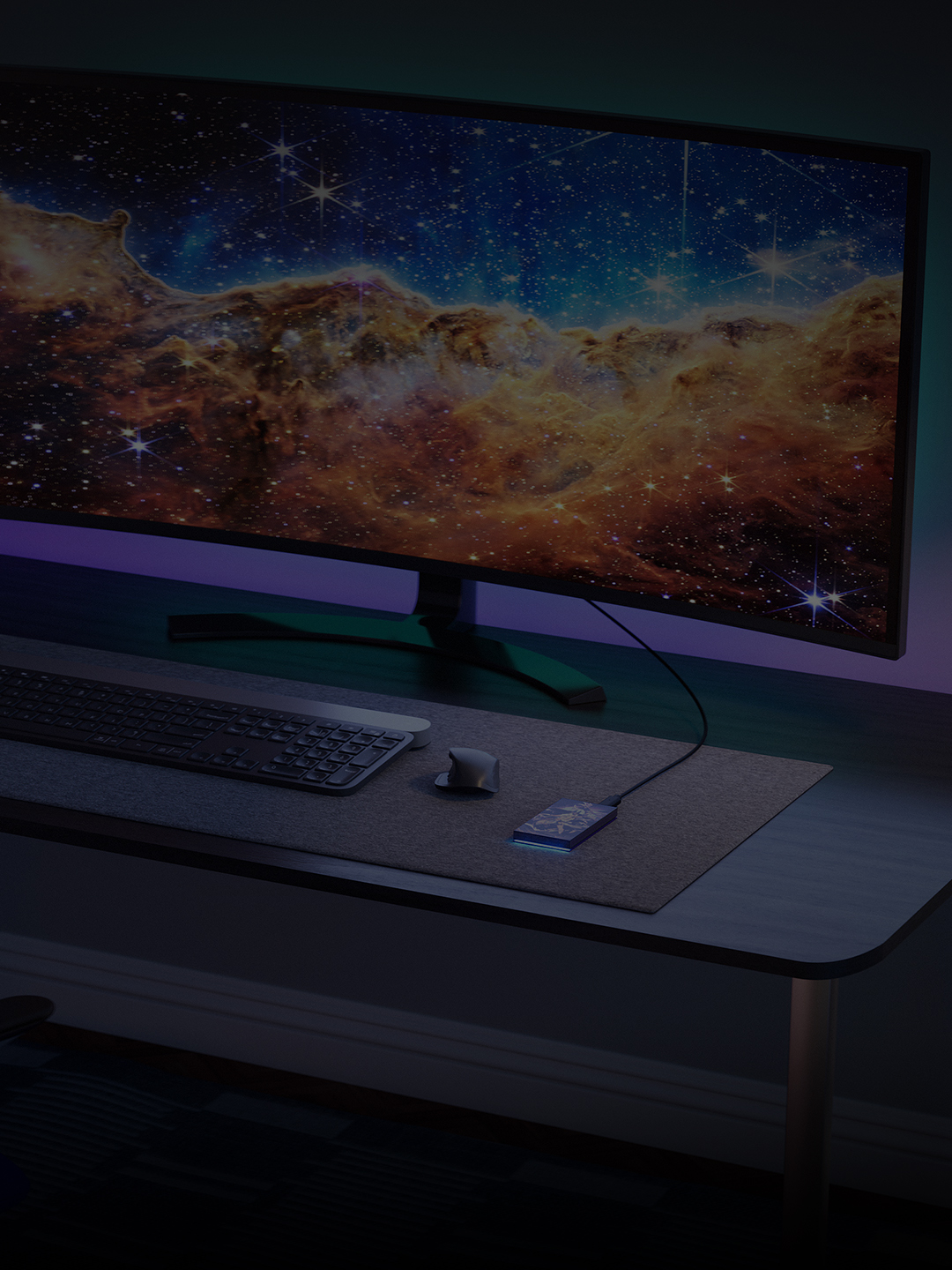 Desktop set-up featuring Genshin Impact Limited Edition External SSD shown alongside keyboard, monitor, and mouse.