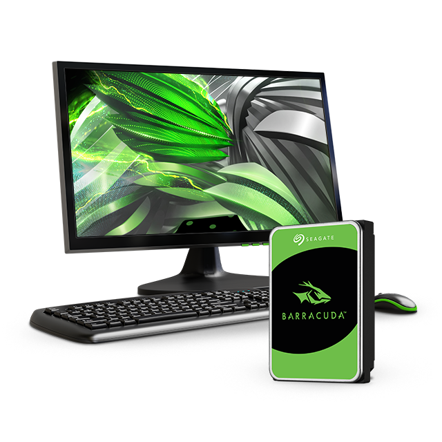 Desktop computer screen, keyboard, and mouse sit behind a BarraCuda hard drive.